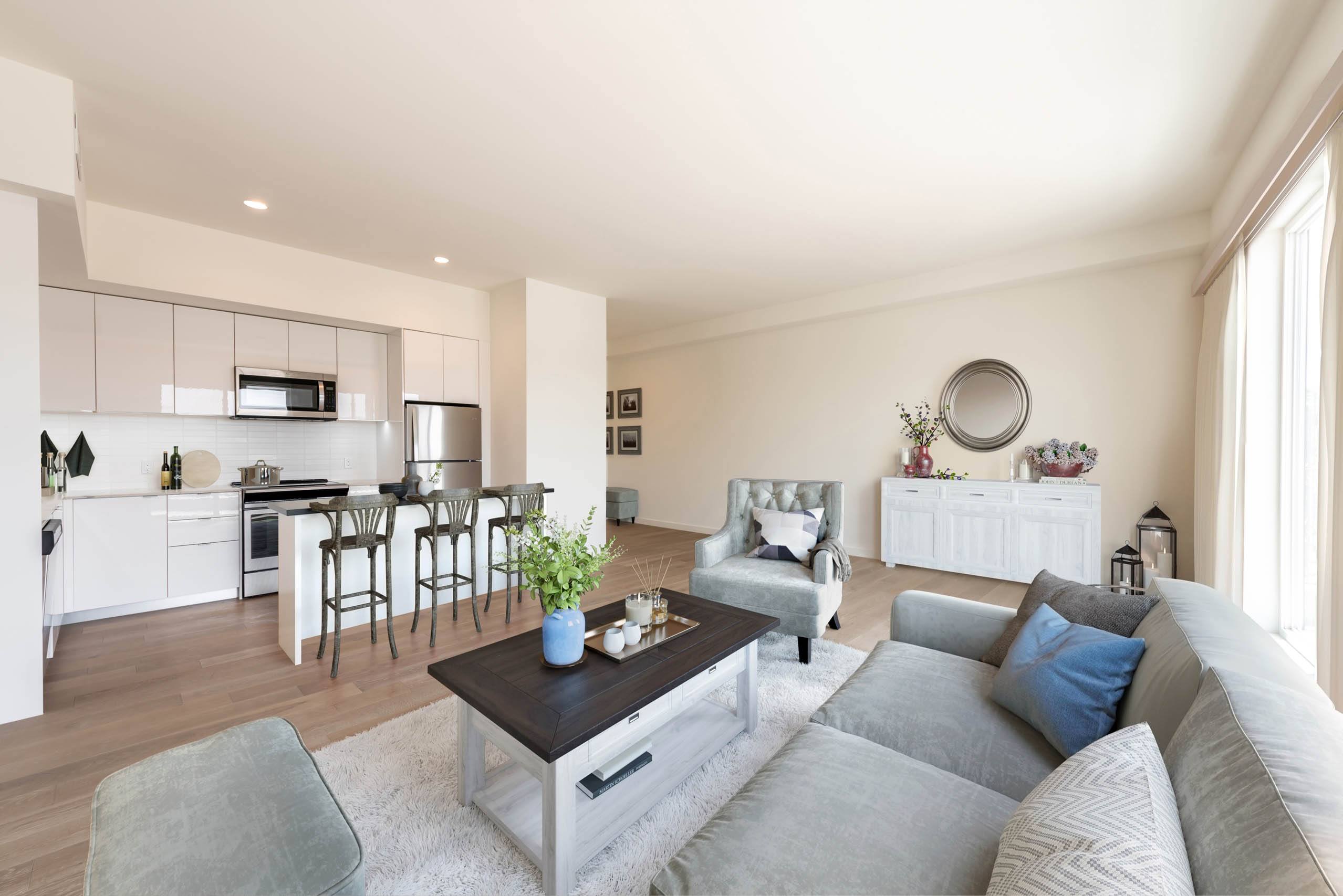 A modern living room with a grey sofa and a coffee table.