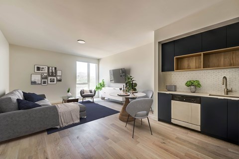A modern living room with a grey sofa and a grey chair.