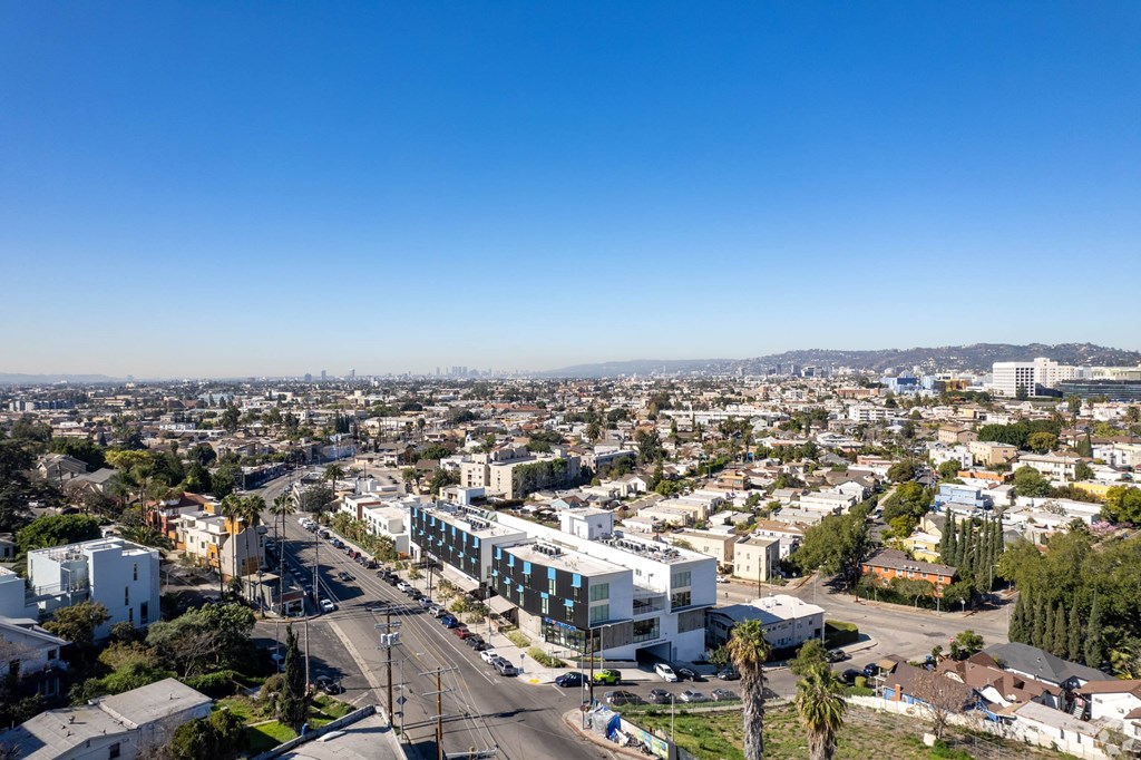 A cityscape with buildings and a clear blue sky.at Junction 4121, Los Angeles, 90029