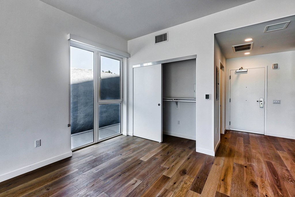 A room with wooden floors and white walls.at 5263 W Adams, California