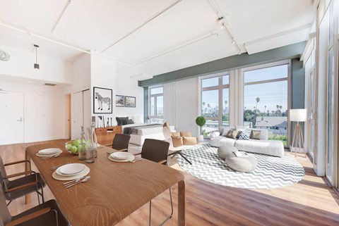 A dining room with a wooden table and chairs.
