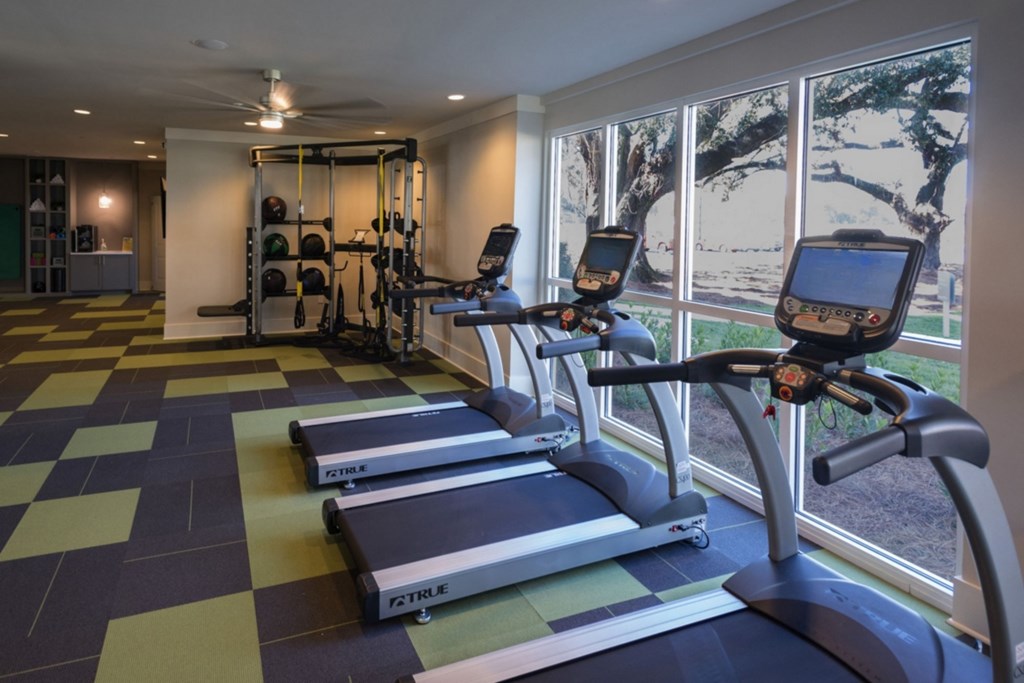 A gym with treadmills and exercise equipment. at Mariner Grove, Savannah, Georgia