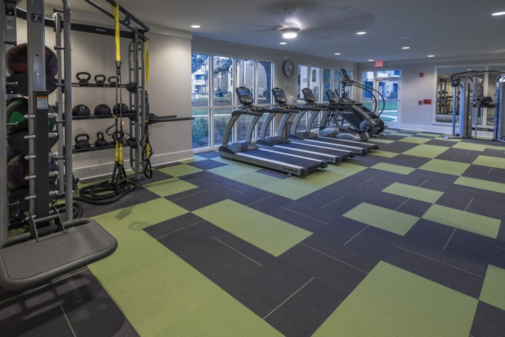A gym with treadmills, weights, and exercise equipment. at Mariner Grove, Savannah
