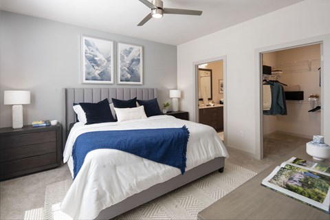 A bedroom with a large bed and a ceiling fan at Las Palmas Apartments, Fort Myers, FL 33913