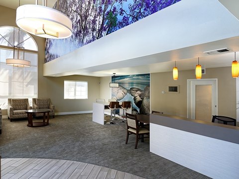 A spacious waiting room with a large mural on the wall.