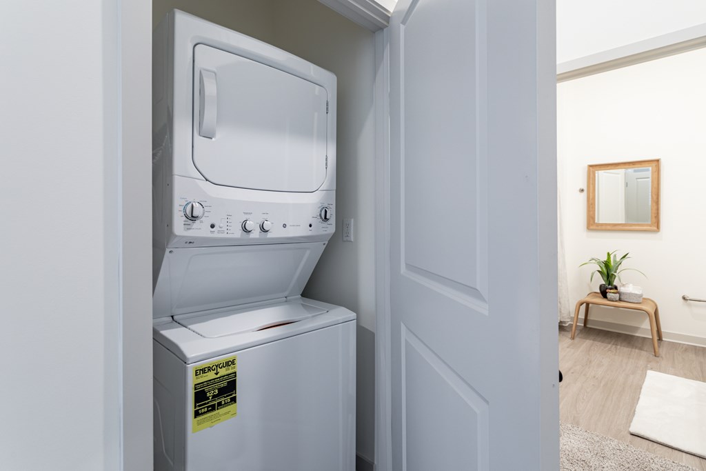 A white oven with a sticker on it is in a room.