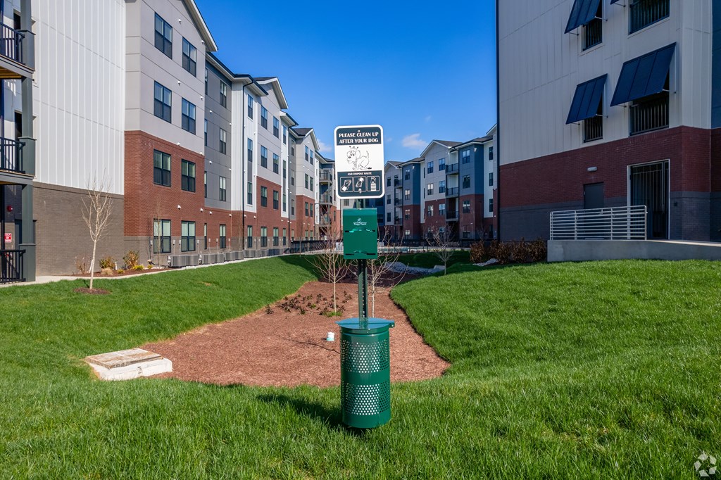 A baseball diamond in a grassy area with a sign that says "Baseball Only".