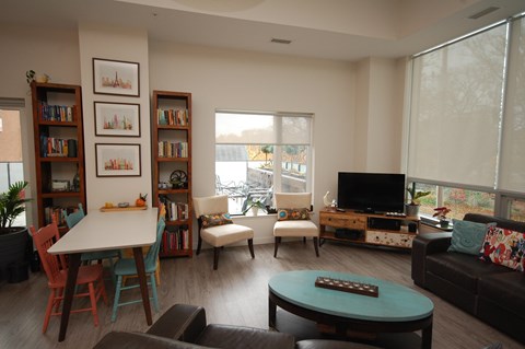 A living room with a white table and a couch.