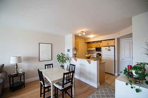 A dining room with a table and chairs is shown.