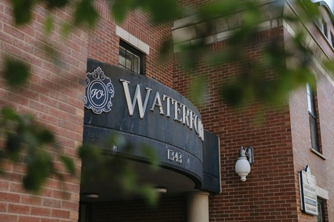 A brick building with a sign that says Waterford.