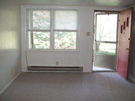 A room with a window and a door.