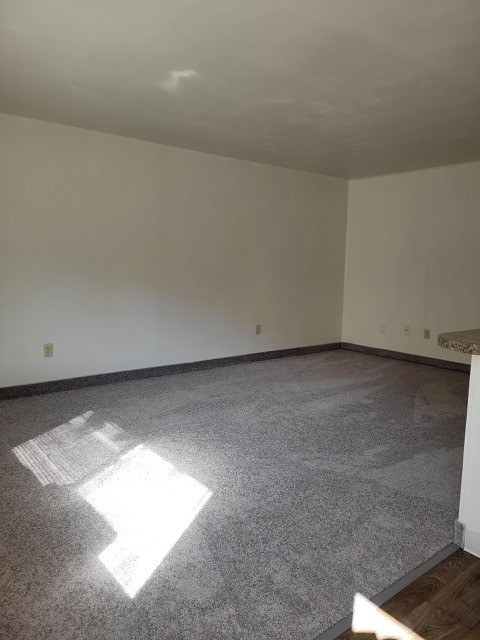 A room with a grey floor and white walls.