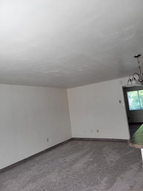 A room with a window and a door.