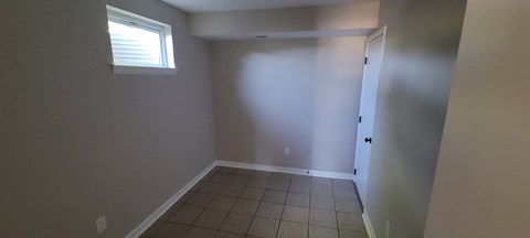 A room with a door and a window.