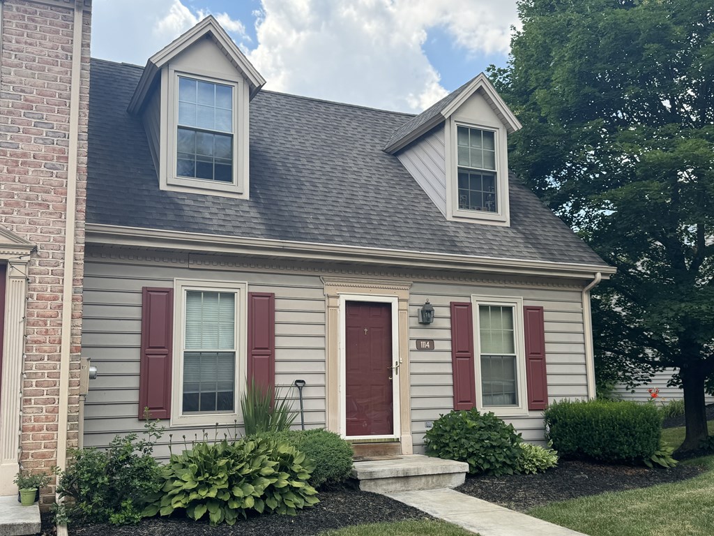 A house with a red door and red shutters.