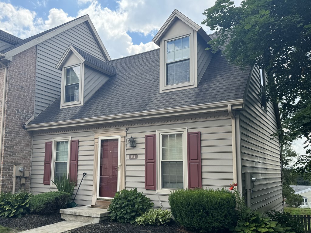 A house with a red door and red shutters.