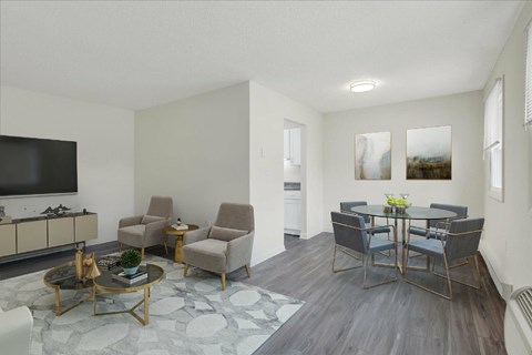 A living room with a grey sofa and a coffee table.