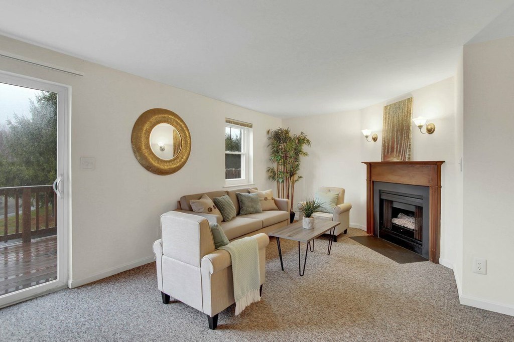 A living room with a fireplace and a couch.