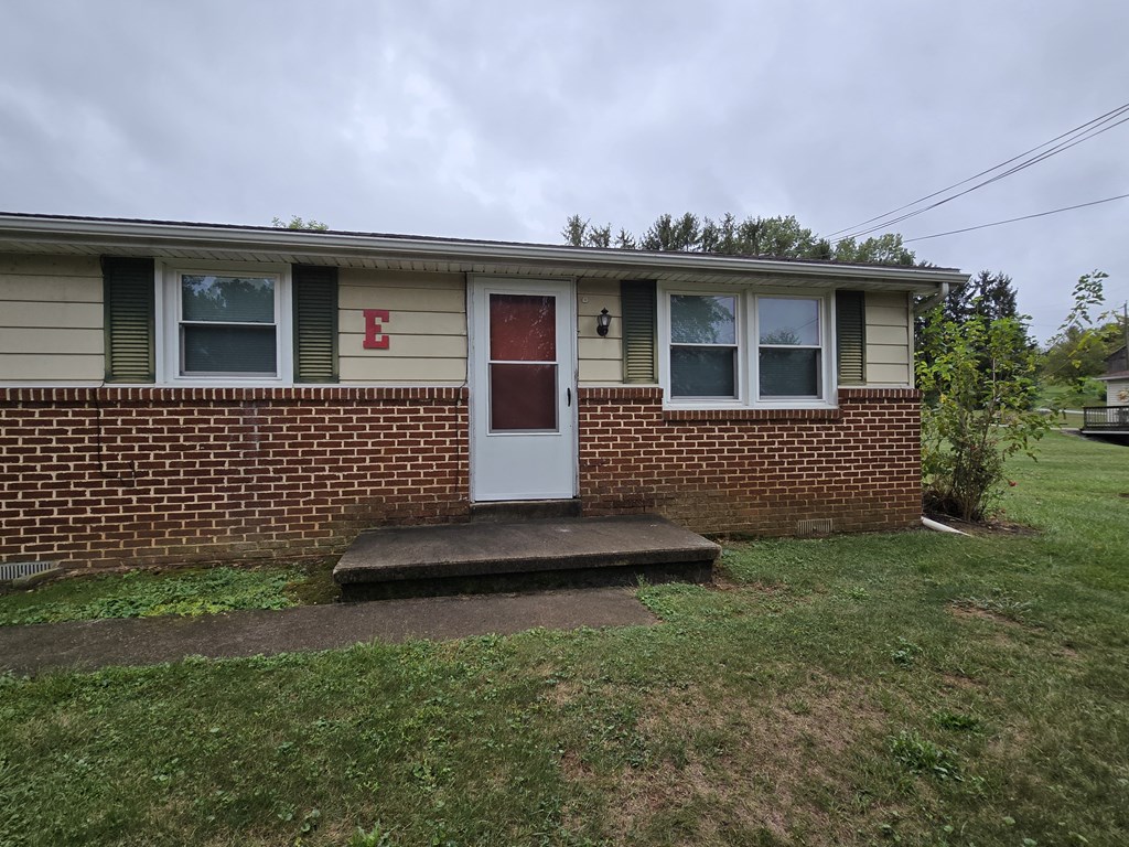 A small house with a red door and a white door.