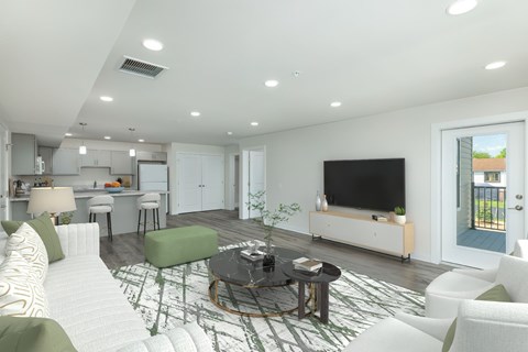 A modern living room with a white sofa and a black coffee table.