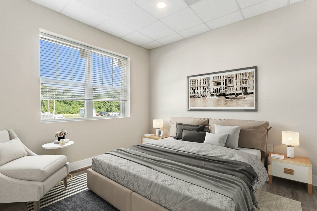 A bedroom with a large bed and a painting on the wall.