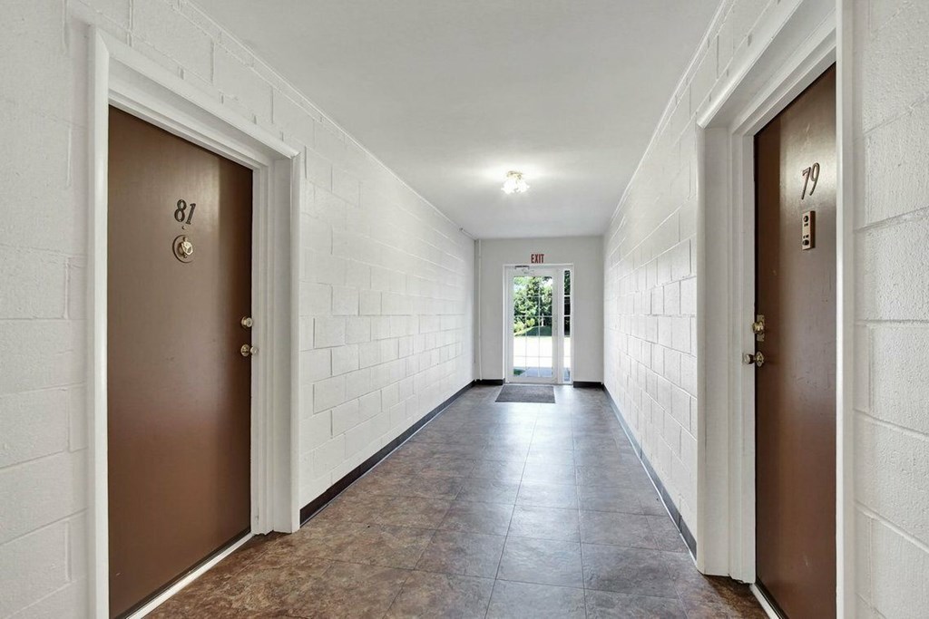 A hallway with doors numbered 81 and 70.