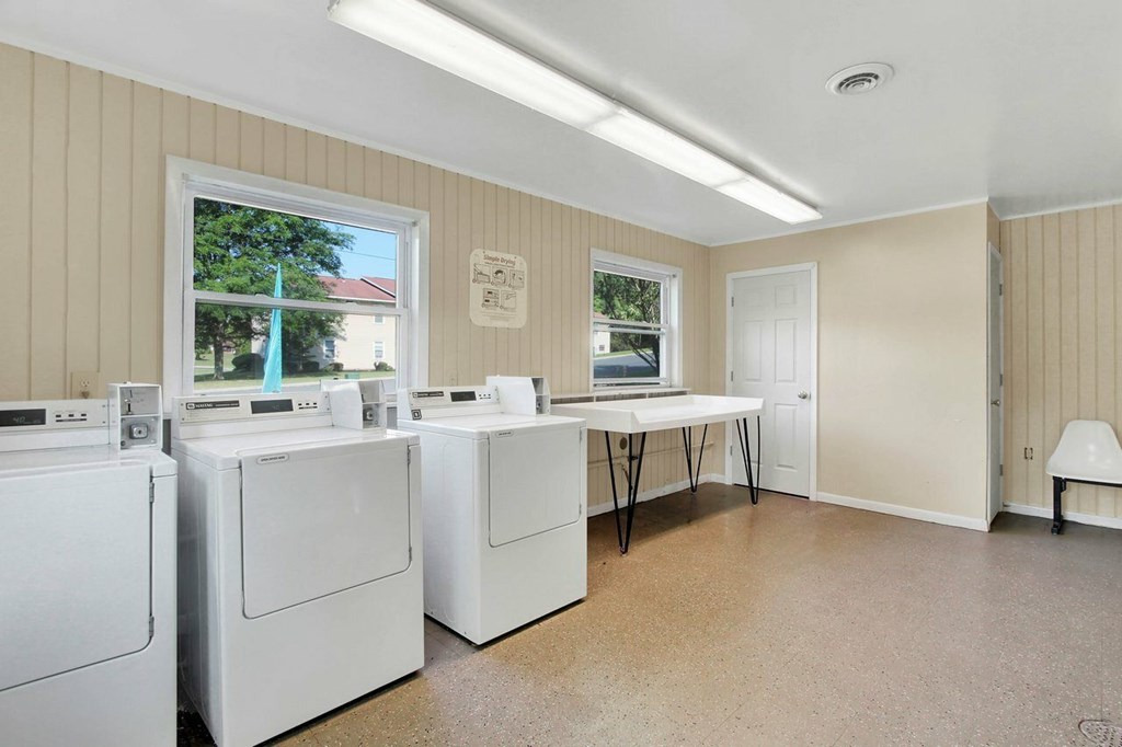 A laundry room with a washer and dryer in it.
