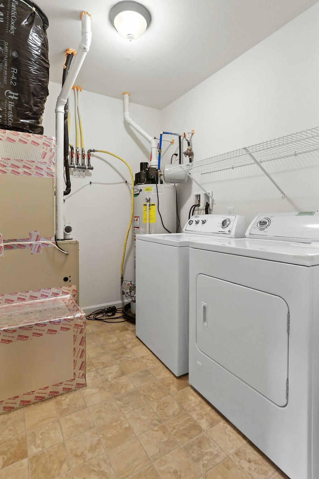 A laundry room with a washer and dryer.