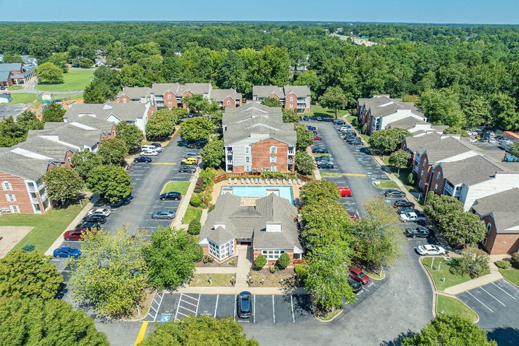 A bird's eye view of a residential area with a large building in the center.