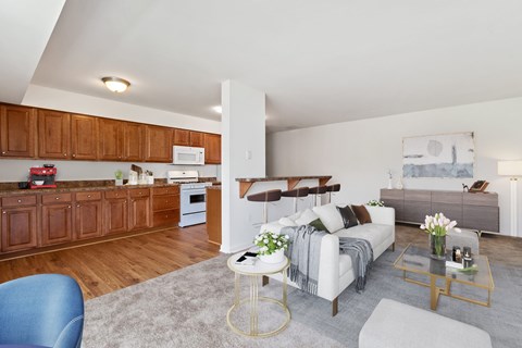 A living room with a white couch and a coffee table.