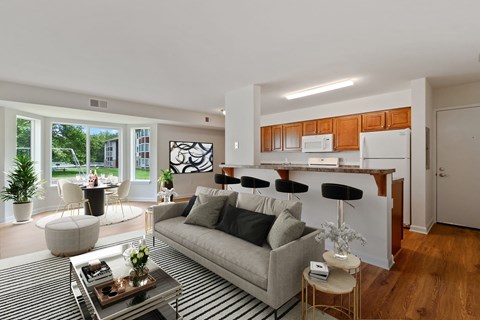 A modern living room with a grey sofa and a coffee table.