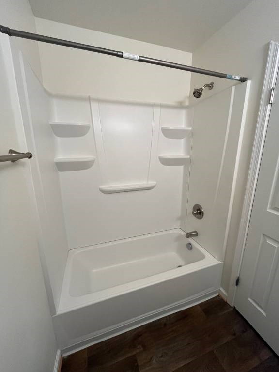 A white bathroom with a walk-in shower.