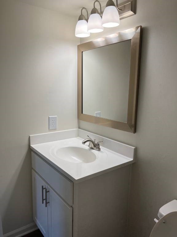A bathroom with a sink and mirror.