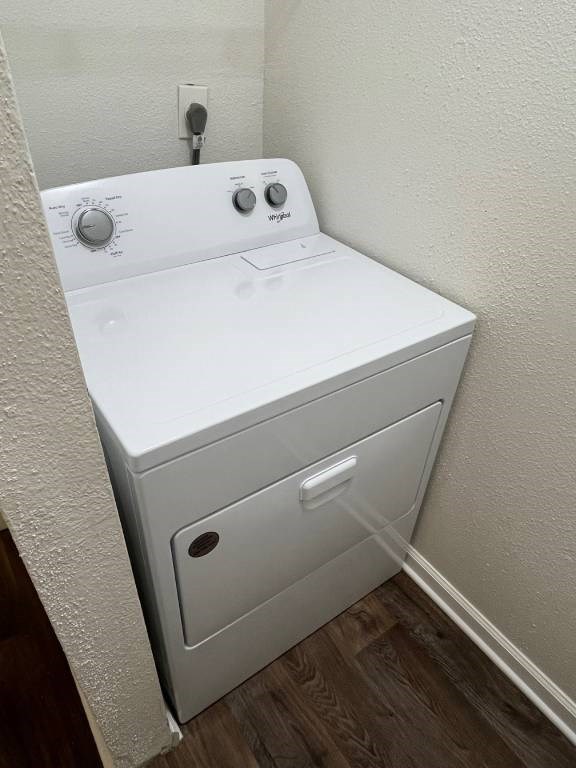 A white washing machine in a small room.