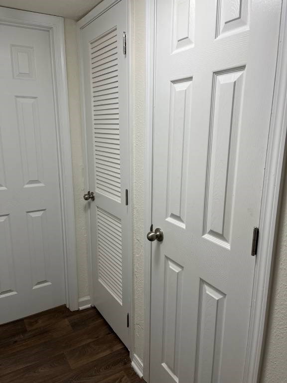 A white door with a black handle is closed.