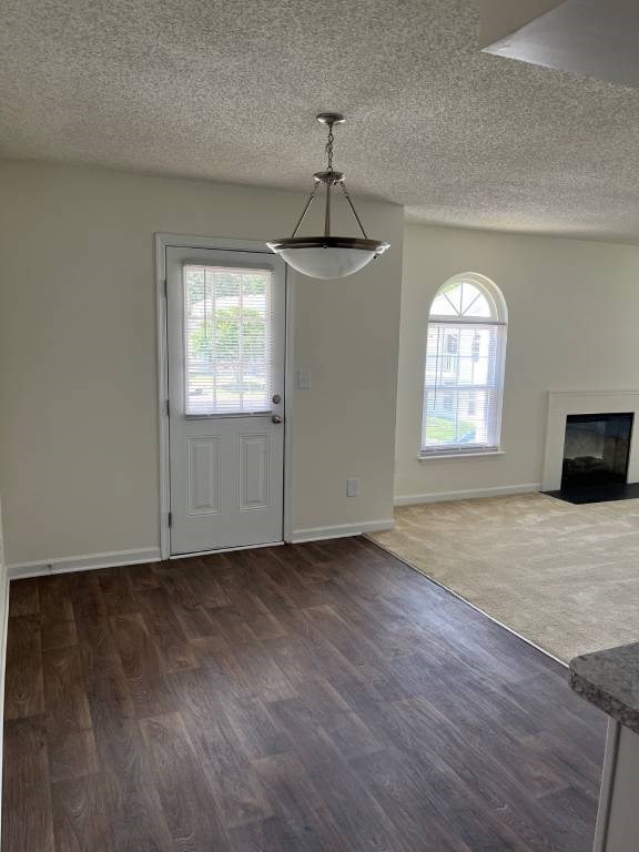 A room with a fireplace and a door.