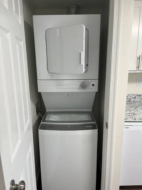 A white dryer and washer in a small laundry room.