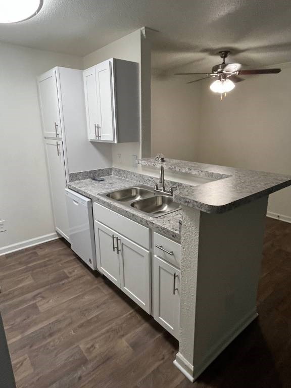 A kitchen with a sink and cabinets.