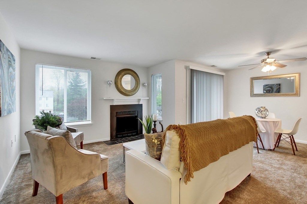 A living room with a fireplace and a couch.