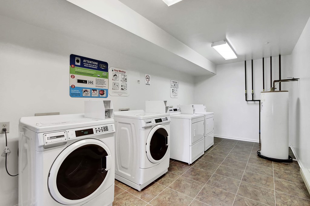 A laundry room with a washer and dryer in it.