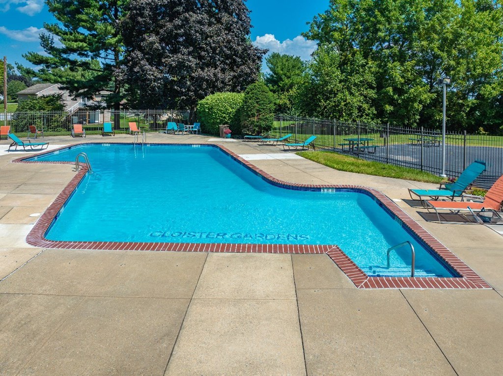 A large blue pool with the words "Cloister Gardens" written on the bottom.