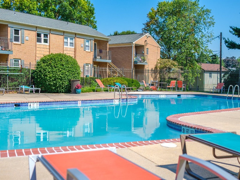 A swimming pool with a red and white striped edge.
