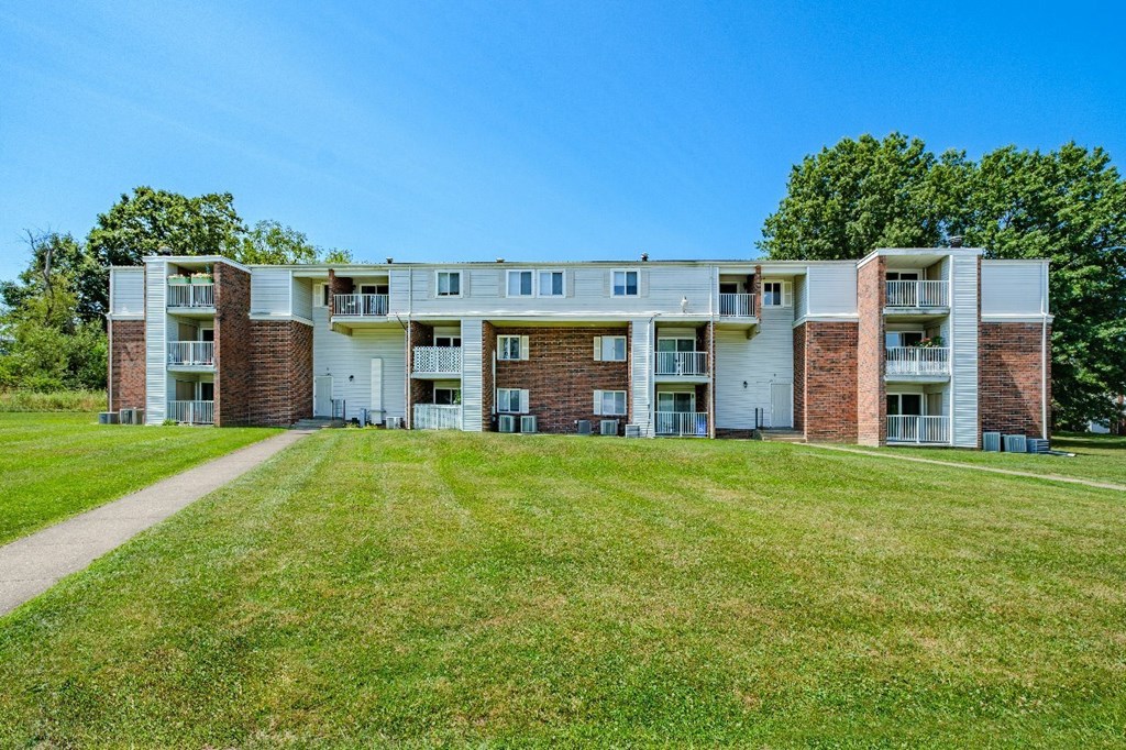 A large apartment complex with multiple buildings and balconies.