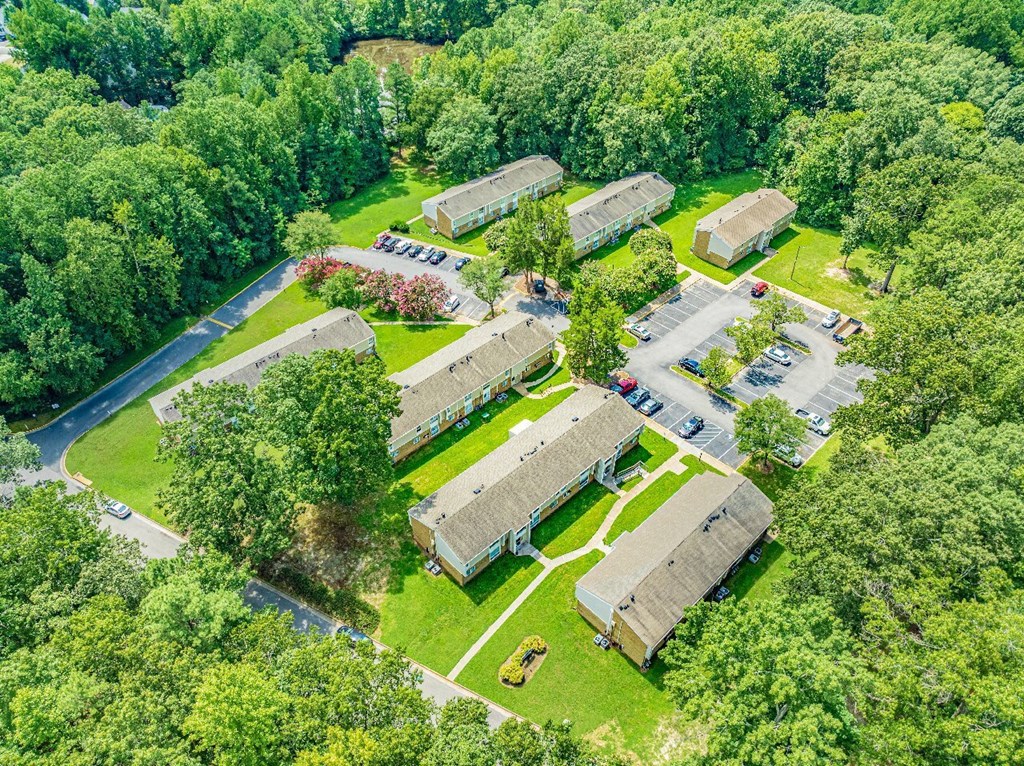 A bird's eye view of a residential area with houses and trees.