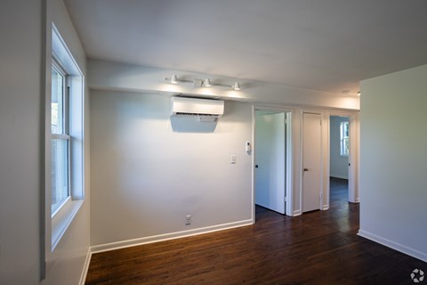 A room with a window and a door.