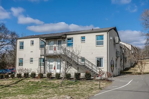Apartment building with a clear blue sky above.