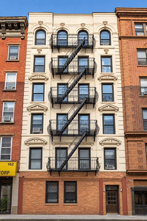 A building with a fire escape on the side.