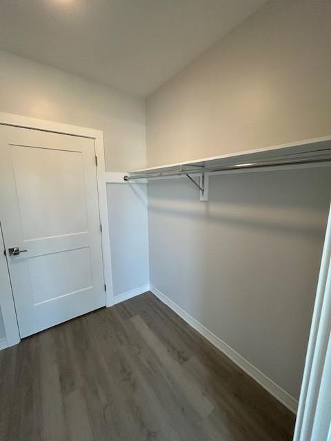 A white door is on the left and a white shelf is on the right.