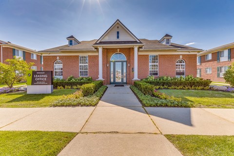 The leasing office is located in a brick building with a welcoming entrance.