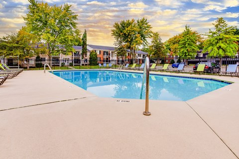 Resort style swimming pool with sundeck at Lancaster Hills Apartments, Southfield
